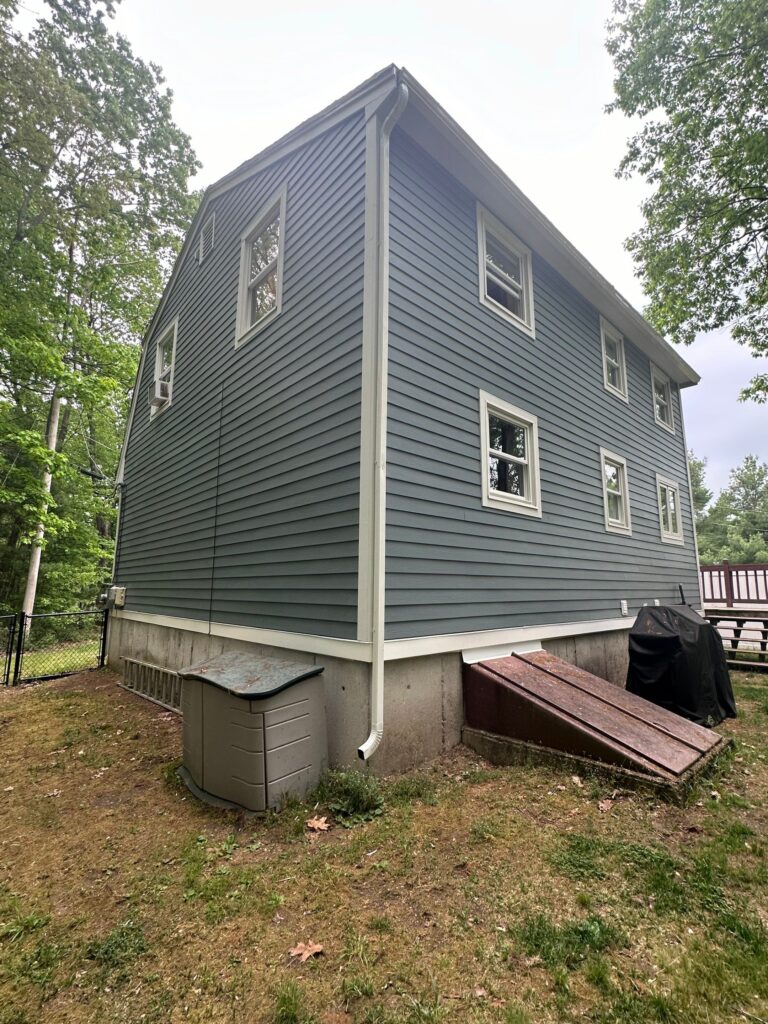 Beautiful James Hardie siding replacement Tewksbury MA transformation featuring smooth plank siding in Boothbay Blue