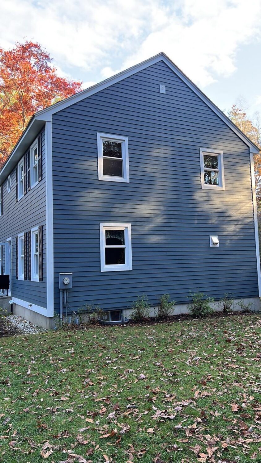 Premium James Hardie fiber cement siding expertly installed in Auburn, NH by Coastal Windows & Exteriors—offering exceptional durability and timeless curb appeal.