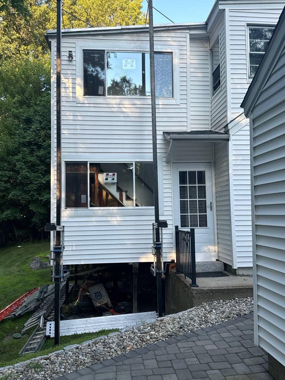 New replacement windows for natural light in Fitchburg MA home exterior, Worcester County, North Central Massachusetts region during summer remodeling