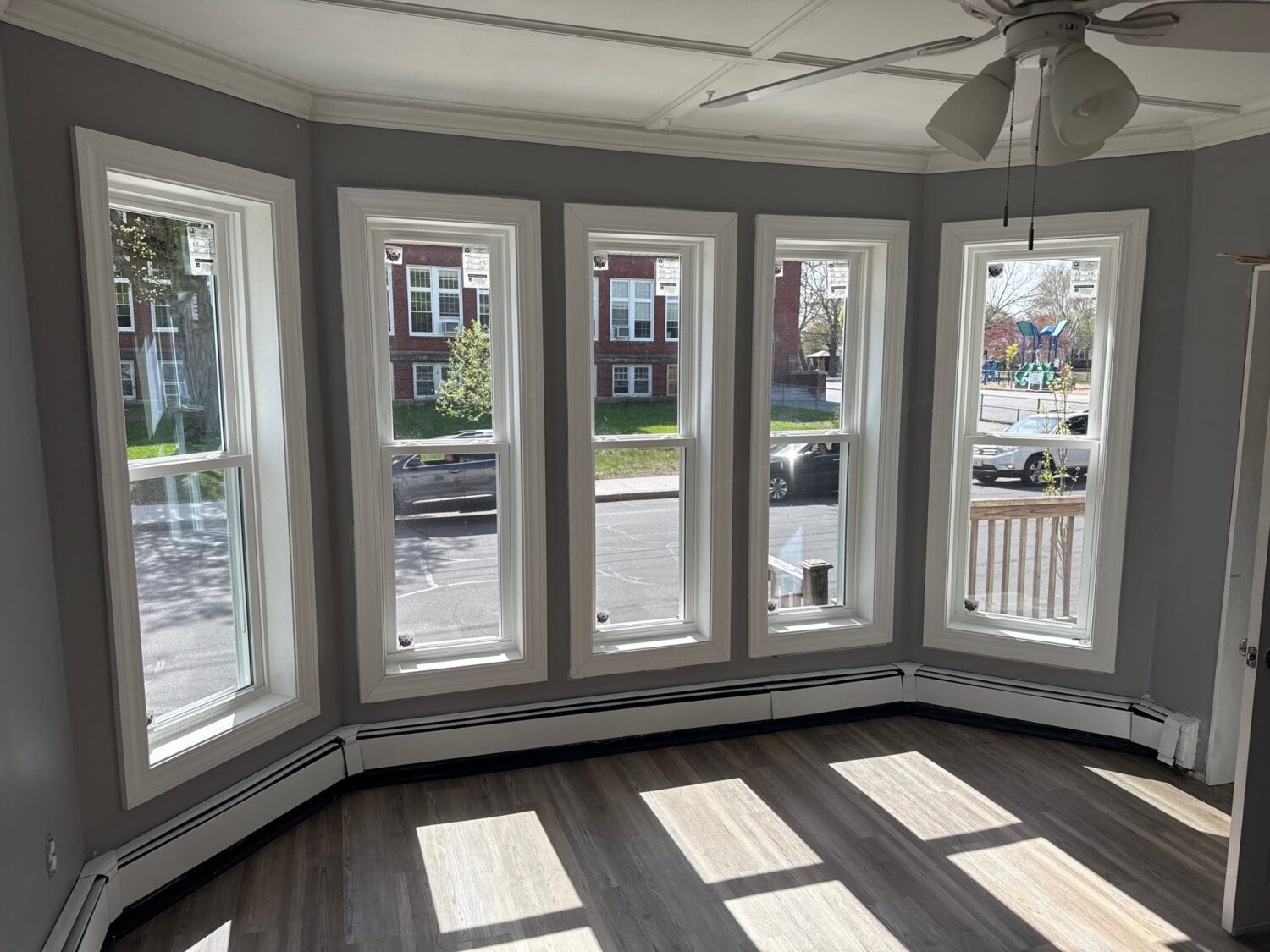 New replacement windows maximizing natural light in Haverhill MA home, Essex County, Merrimack Valley region during summer remodeling