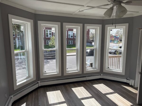 New replacement windows maximizing natural light in Haverhill MA home, Essex County, Merrimack Valley region during summer remodeling
