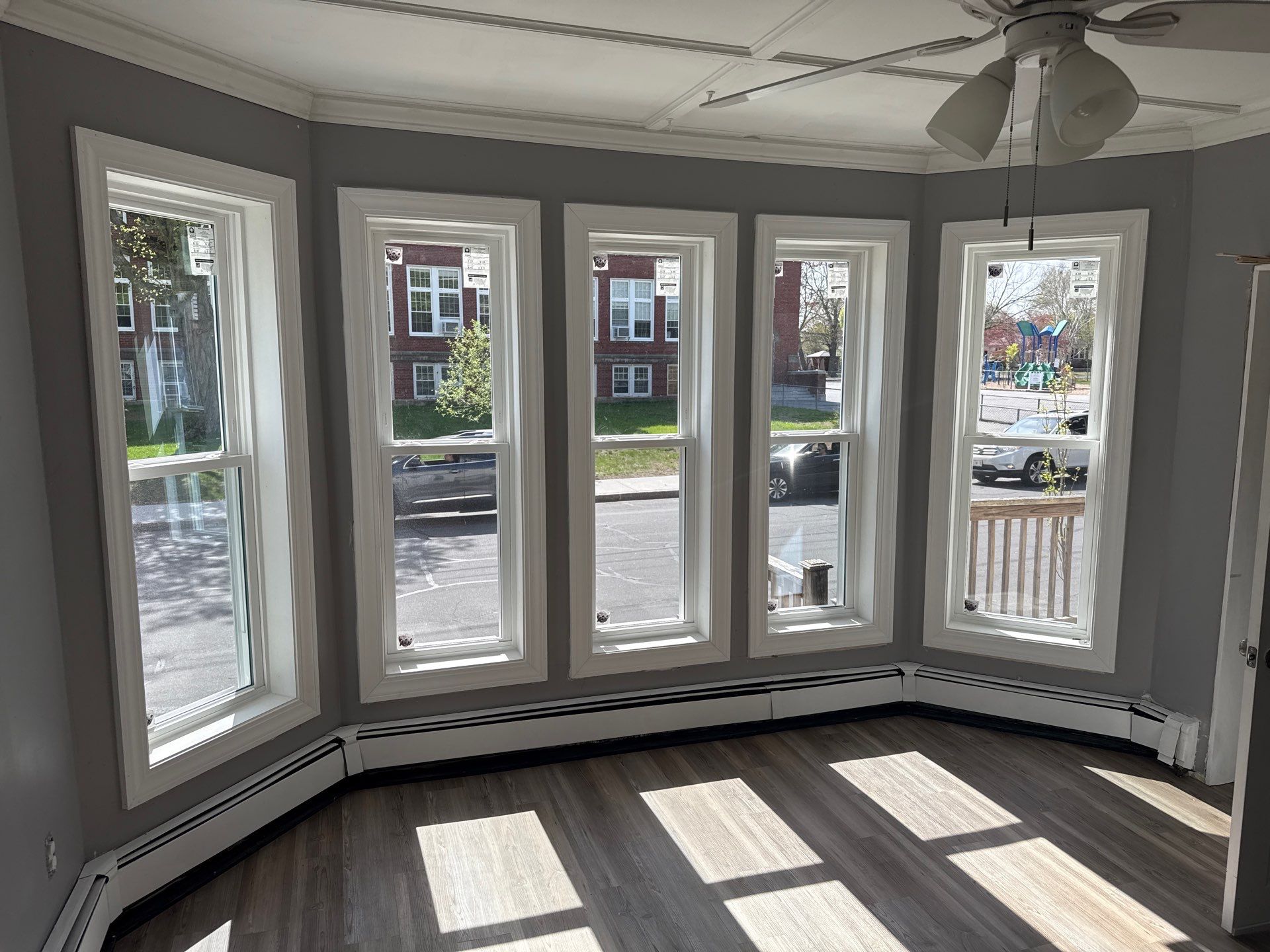 New replacement windows maximizing natural light in Haverhill MA home, Essex County, Merrimack Valley region during summer remodeling