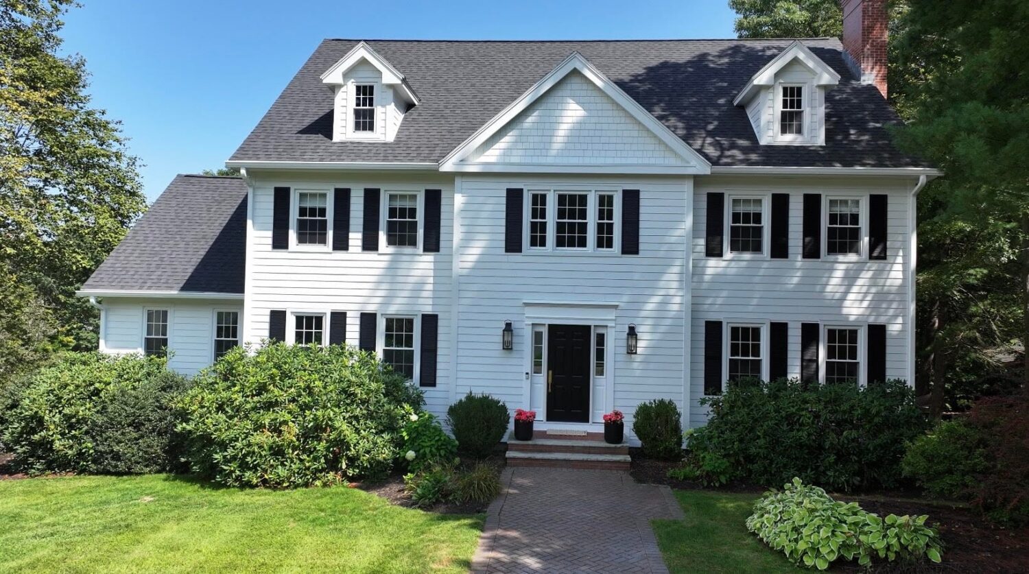 Arctic white James Hardie siding installation on a Beverly MA home as one of the best summer home exterior projects.