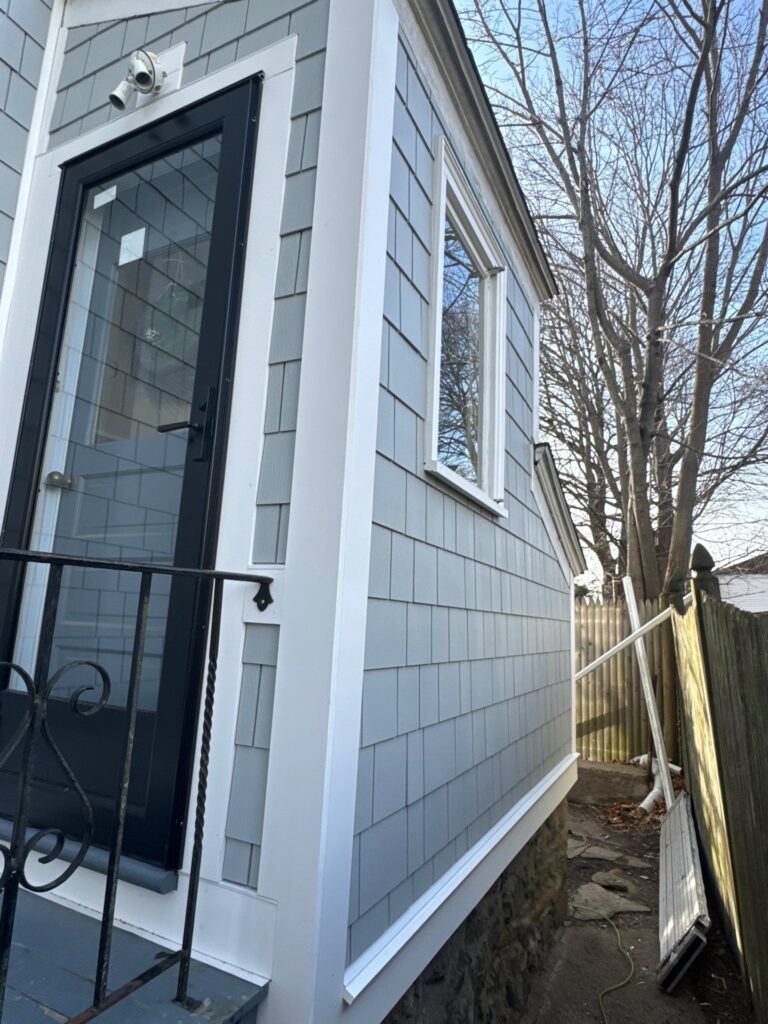 James Hardie siding replacement Swampscott MA completed shake siding project in Light Mist color