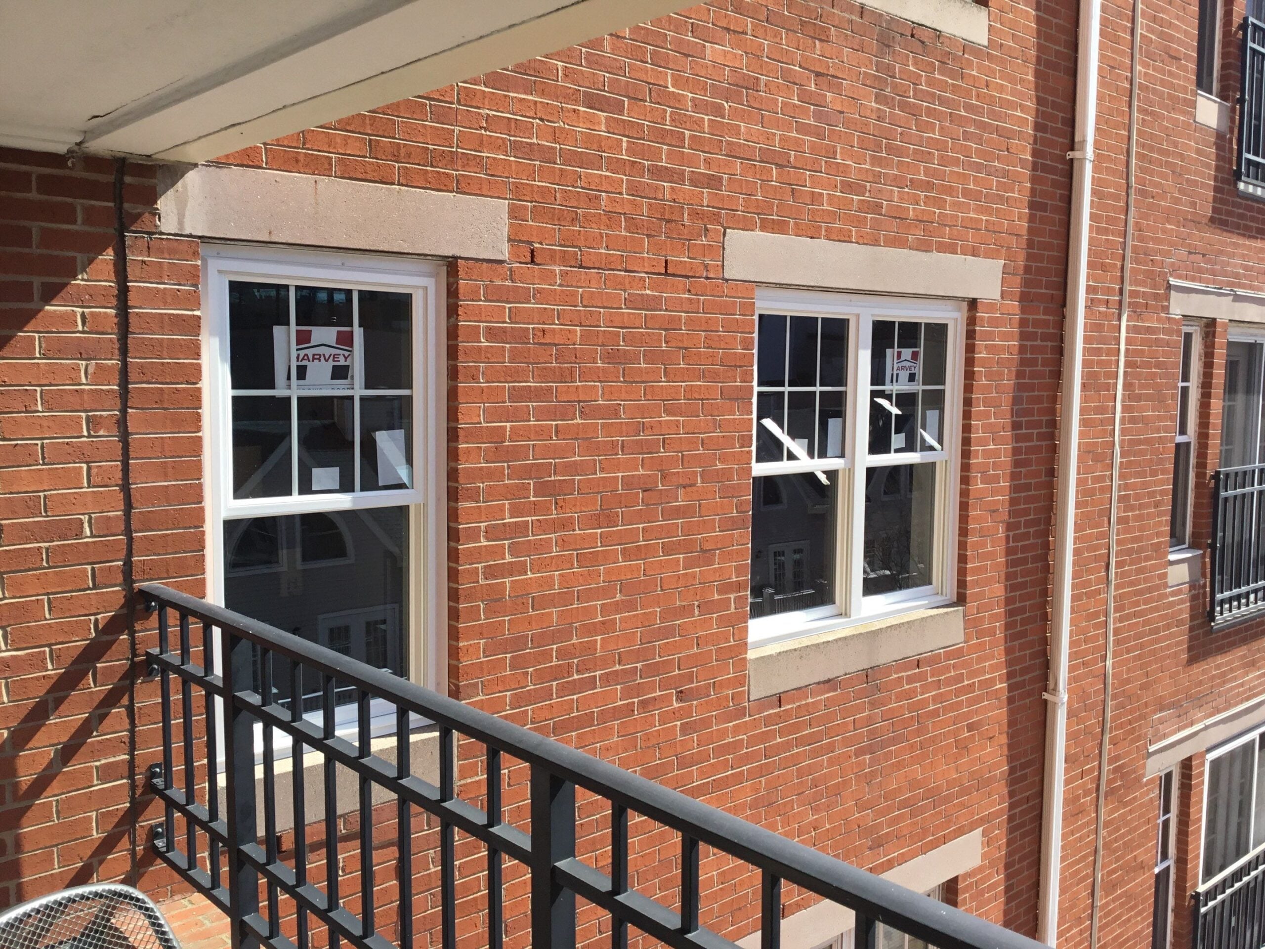 New double-hung windows were installed on this brick residential building to improve insulation and overall appearance. It’s Time to Replace Your Windows if aging windows are contributing to drafts, rising energy bills, or outdated curb appeal.