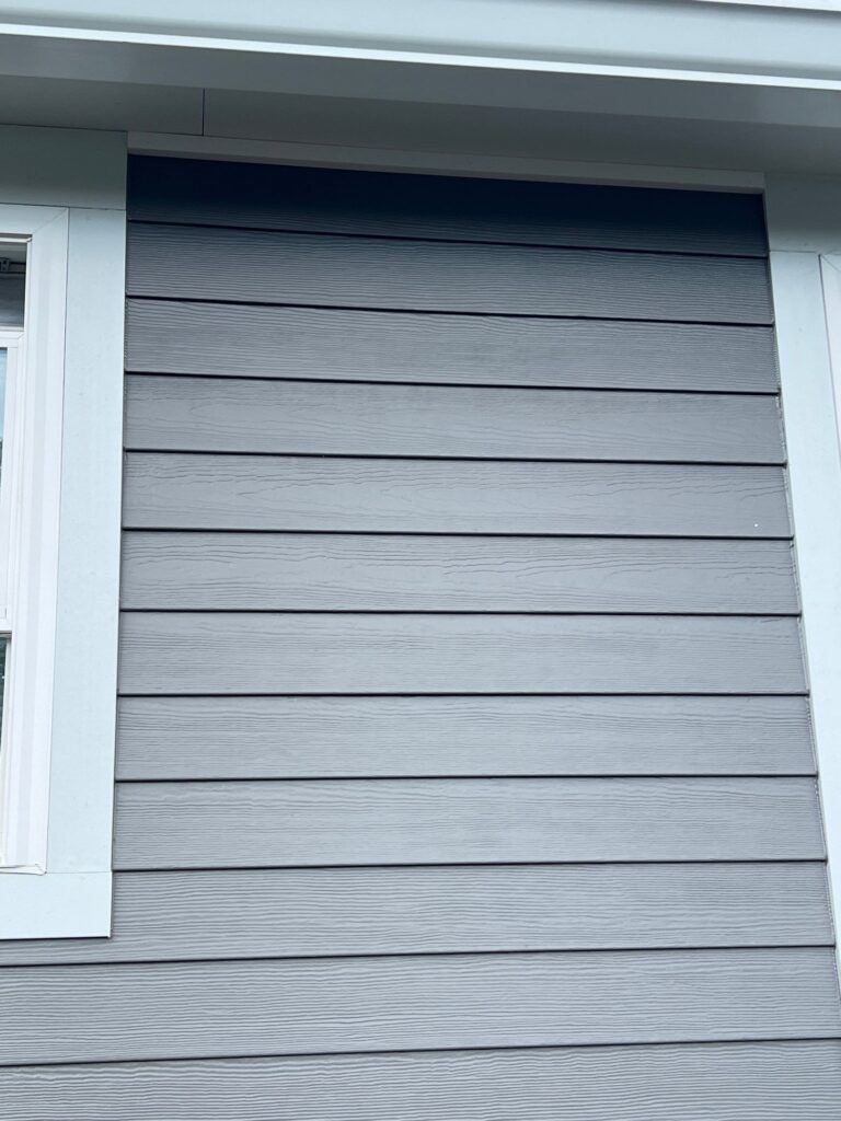 Professional James Hardie siding installation completed on Laconia NH, Central NH, Belknap County home by Coastal Windows & Exteriors