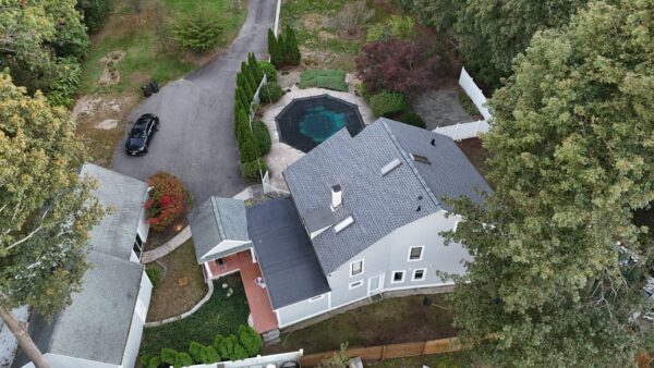 Skylight replacement during roof replacement Beverly MA — before and after leak repair by Coastal Windows and Exteriors