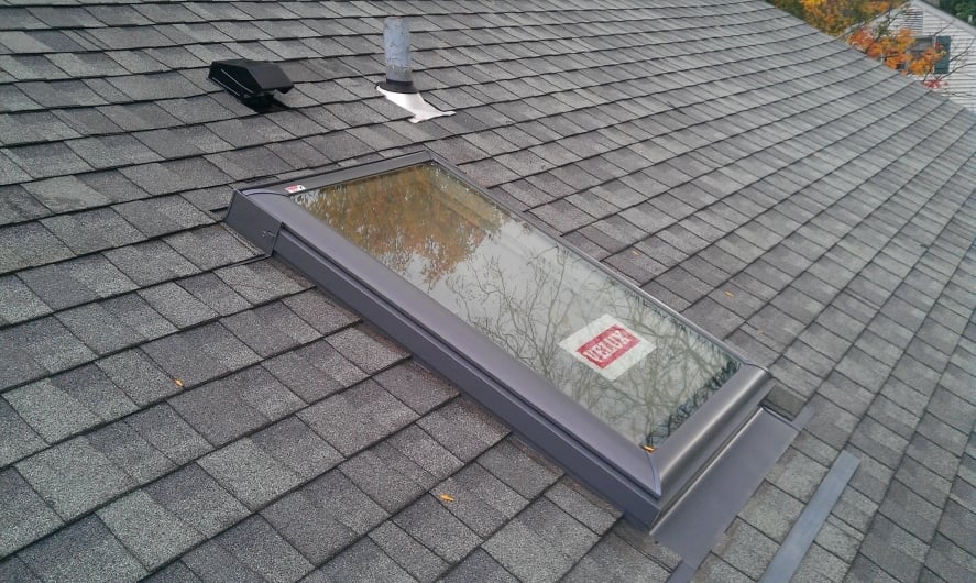 Modern skylight integrated into a new roof installation demonstrating should you replace skylights when replacing roof