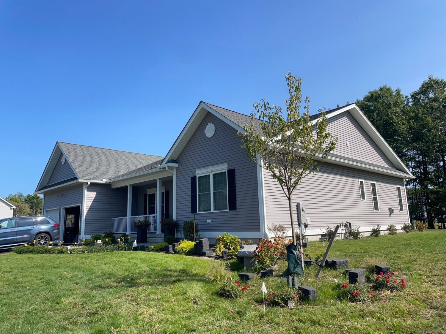 Low-maintenance vinyl siding installation eliminating upkeep in Merrimack NH, Hillsborough County by expert Merrimack siding contractor