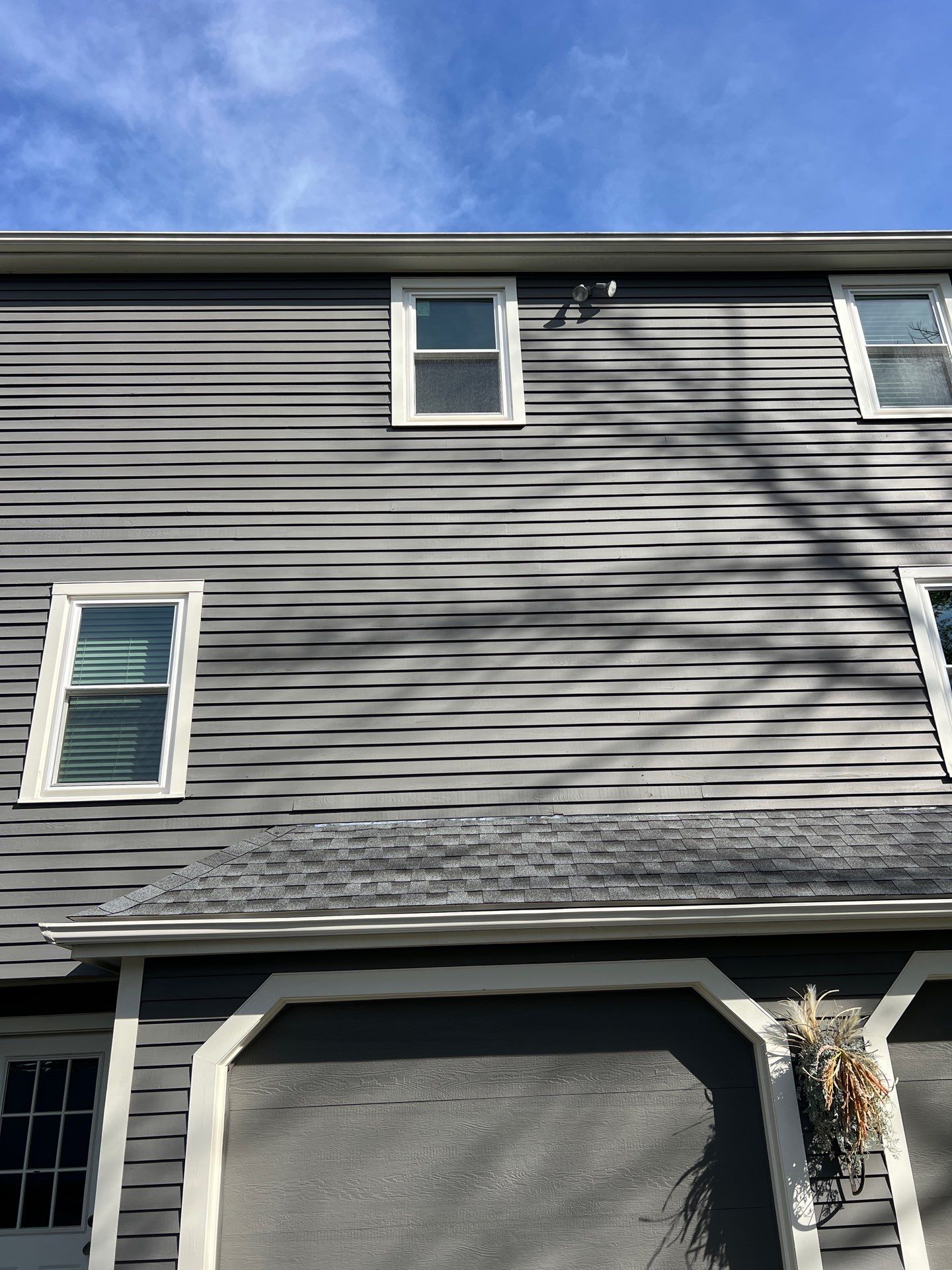 Attleboro MA home exterior featuring new energy-efficient replacement windows installed by Coastal Windows & Exteriors.