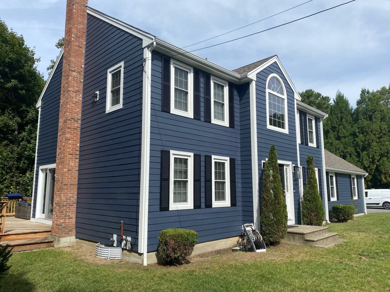 Curb appeal upgrade completed by best James Hardie siding contractors Temple NH on a classic New England home