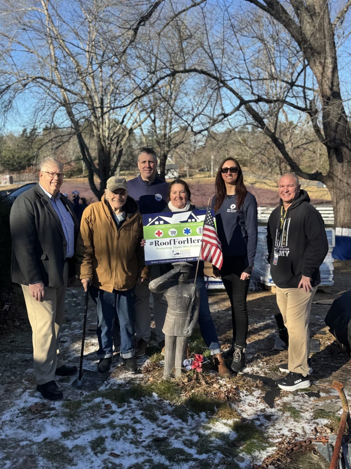 Coastal Windows & Exteriors team celebrates a completed Roof For Heroes project in Holliston MA.