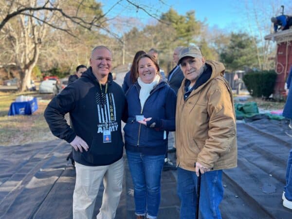Coastal Windows & Exteriors team celebrates a Roof For Heroes project completion in Milford MA.