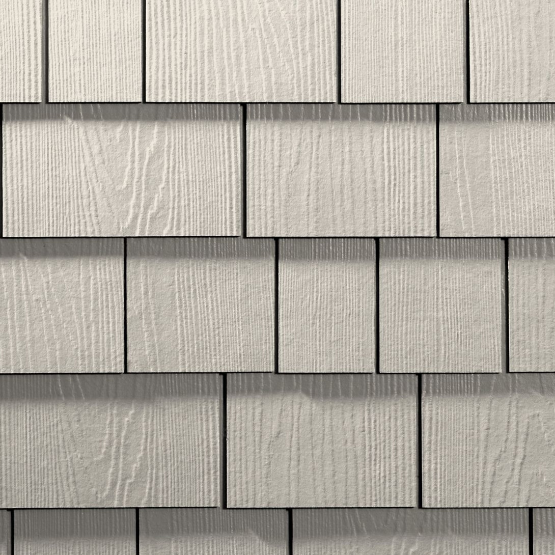 Close-up of siding shingles featured in siding faq about materials and durability.