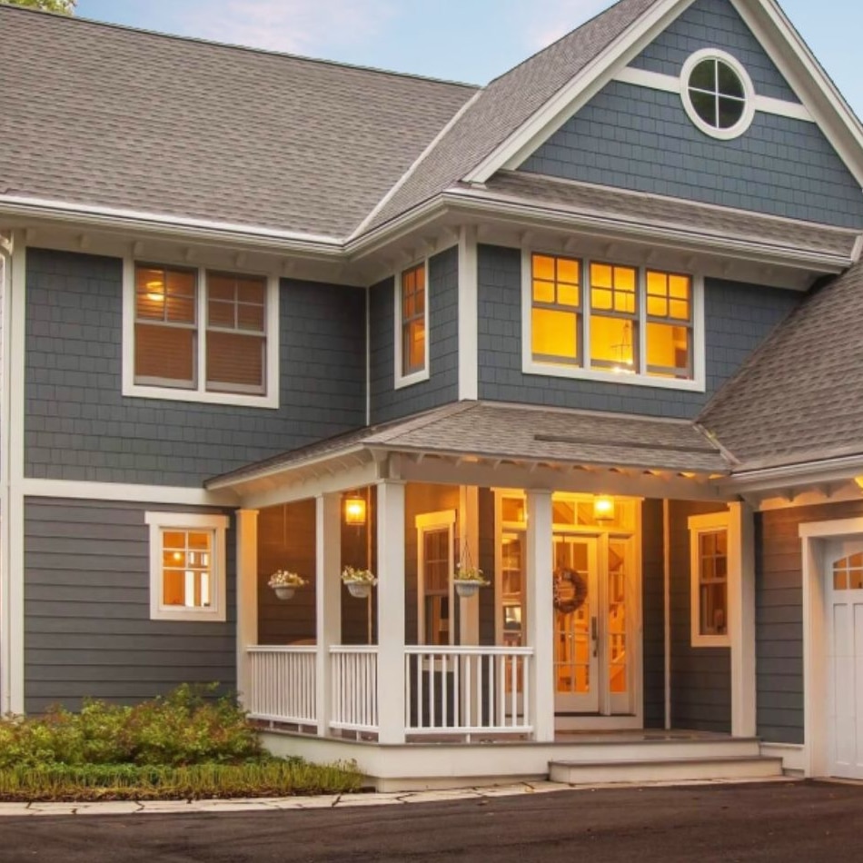Gray home exterior with siding upgrade featured in siding faq guide.