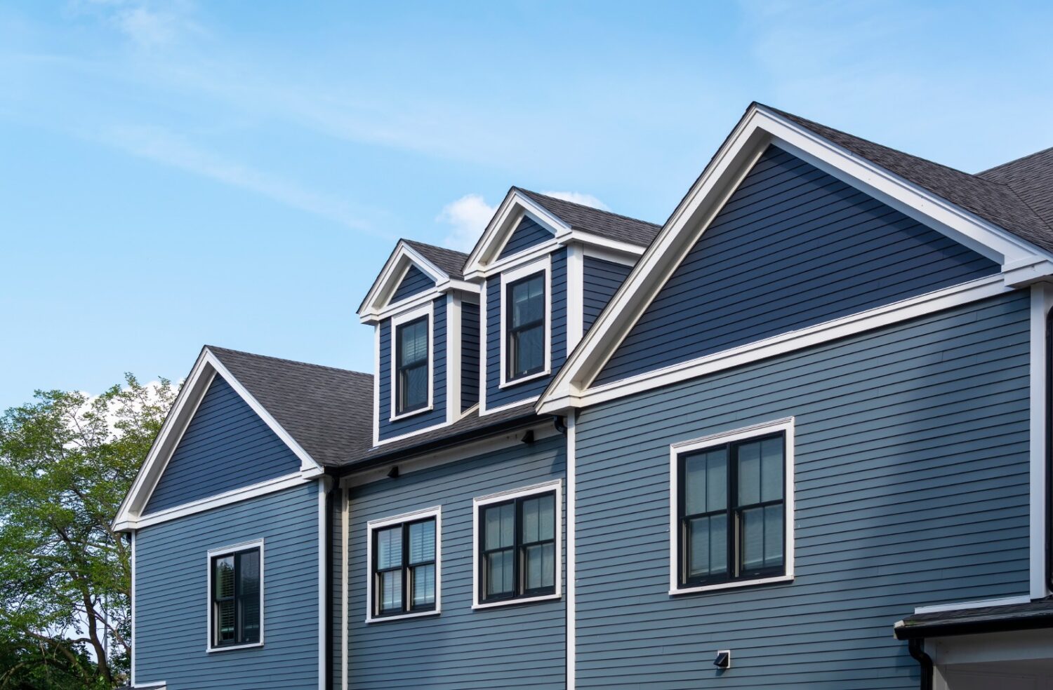 modern coastal house finished by james hardie siding contractor Cohasset MA using fiber cement siding for strength and longevity.