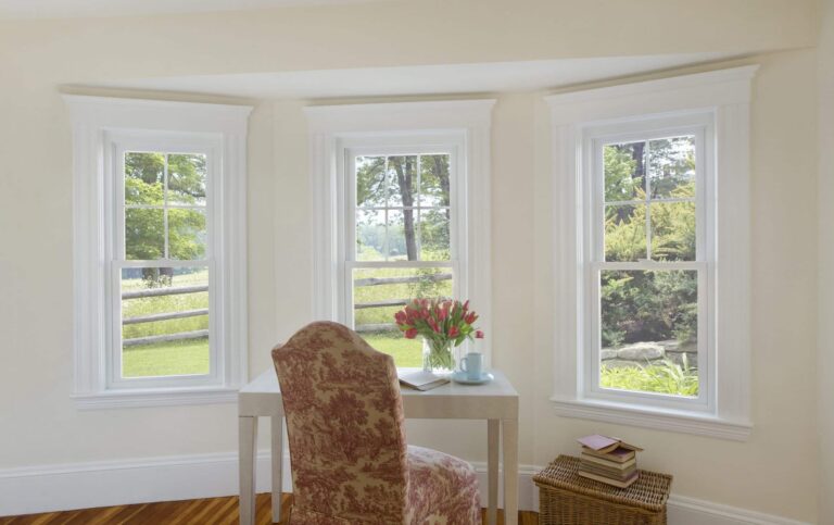 bright interior featuring window replacement Dedham MA with multiple energy efficient windows bringing in natural light and outdoor views.
