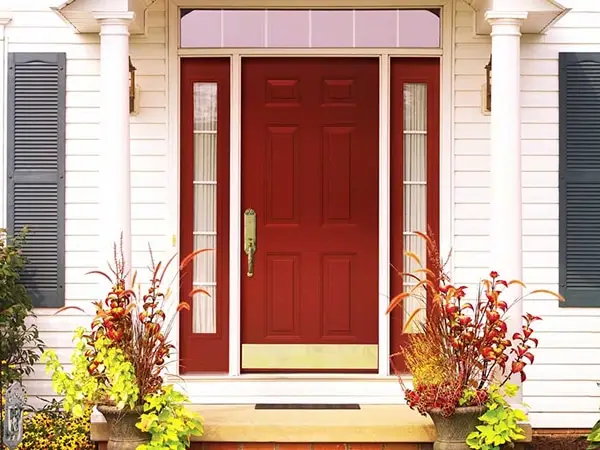 Red front entry door installed during exterior remodeling in Grafton County NH