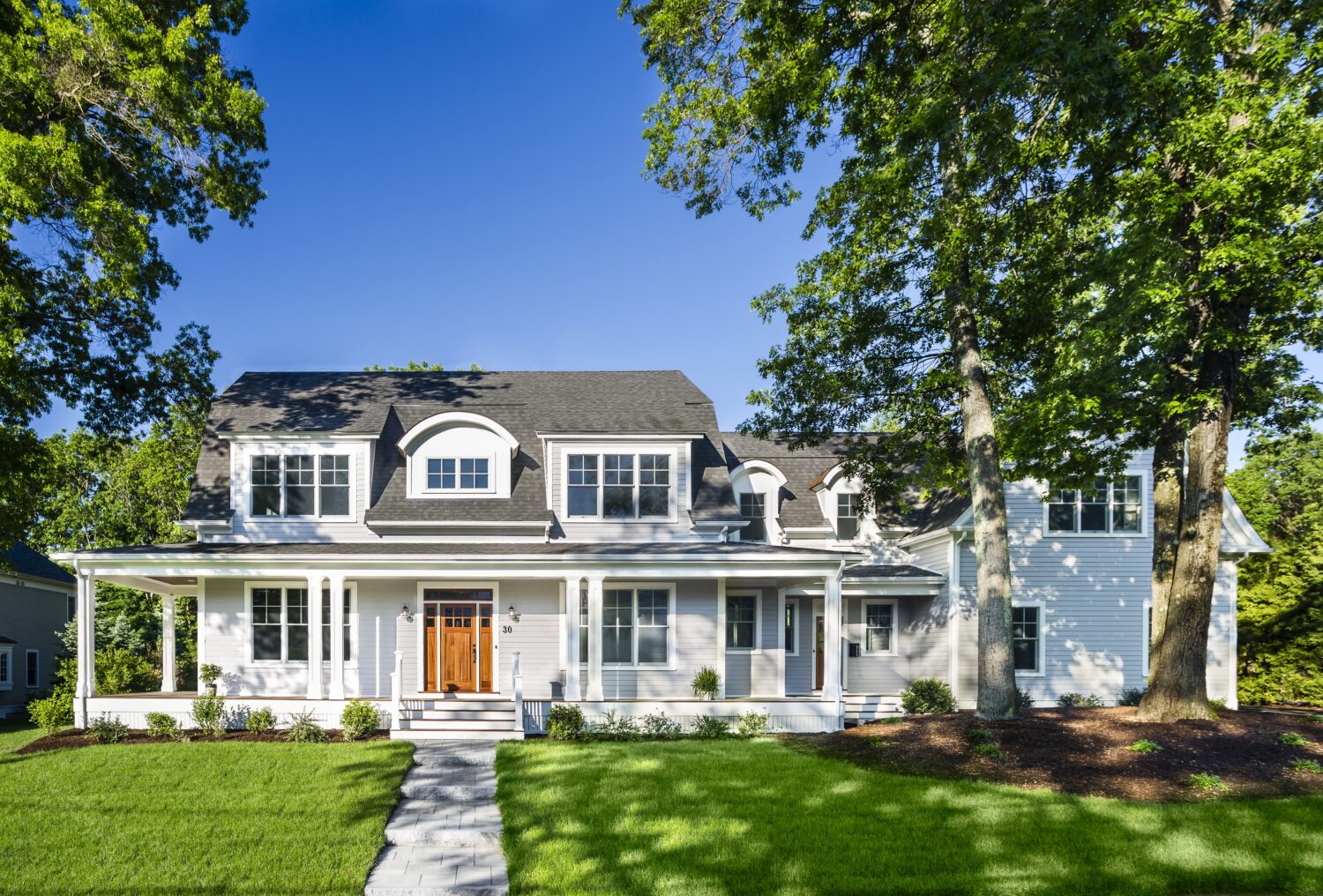 Modern exterior transformation boosting curb appeal with James Hardie fiber cement siding in Holbrook MA