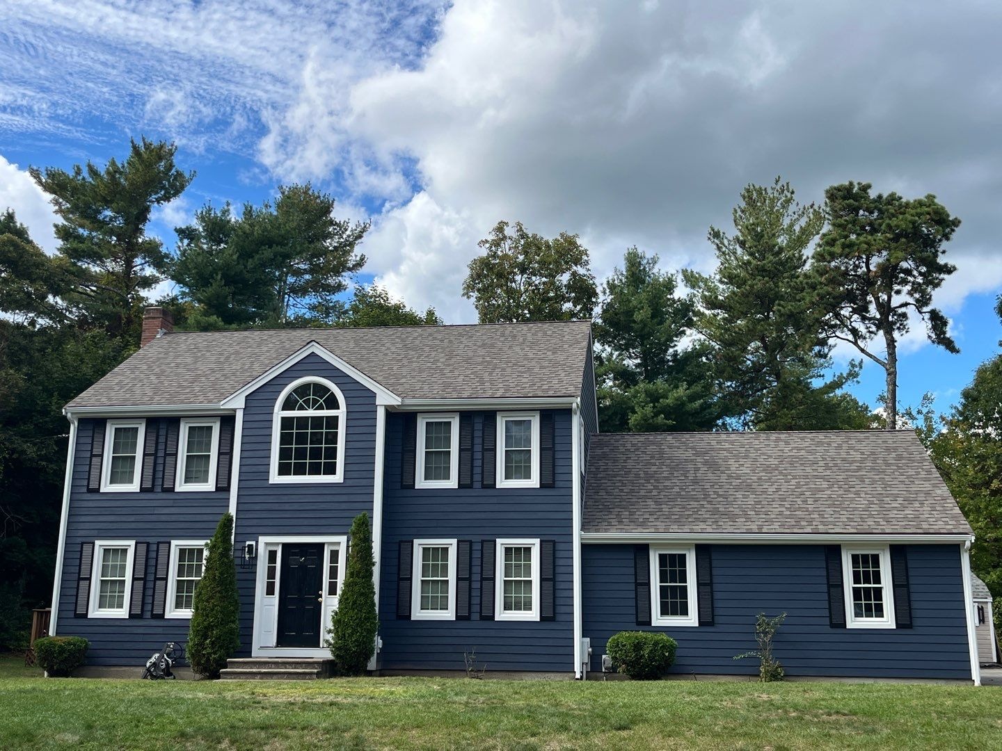 Durable low-maintenance exterior finished with James Hardie siding built to withstand Holbrook MA weather conditions