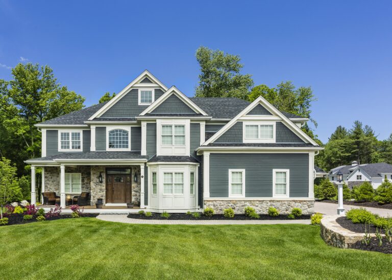 Modern home exterior upgraded by a vinyl siding company in Holbrook MA to enhance curb appeal and durability