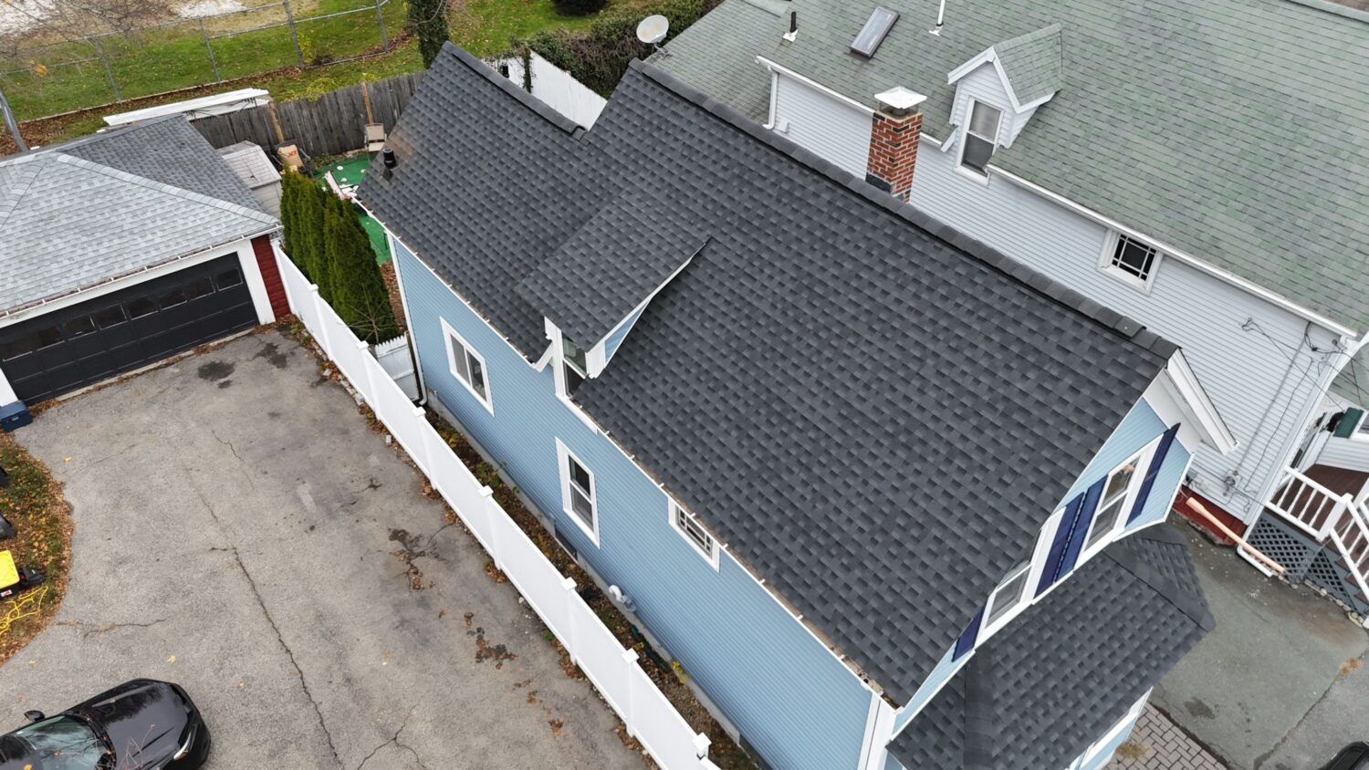 Newly installed architectural shingle roof helping prevent algae on roof while providing superior weather protection in Gloucester, MA.