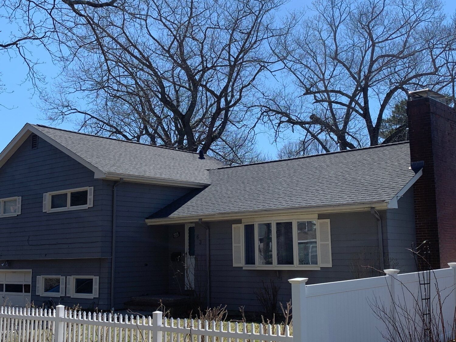 Recently replaced asphalt shingle roof free of algae on roof, providing lasting leak protection and improved curb appeal.