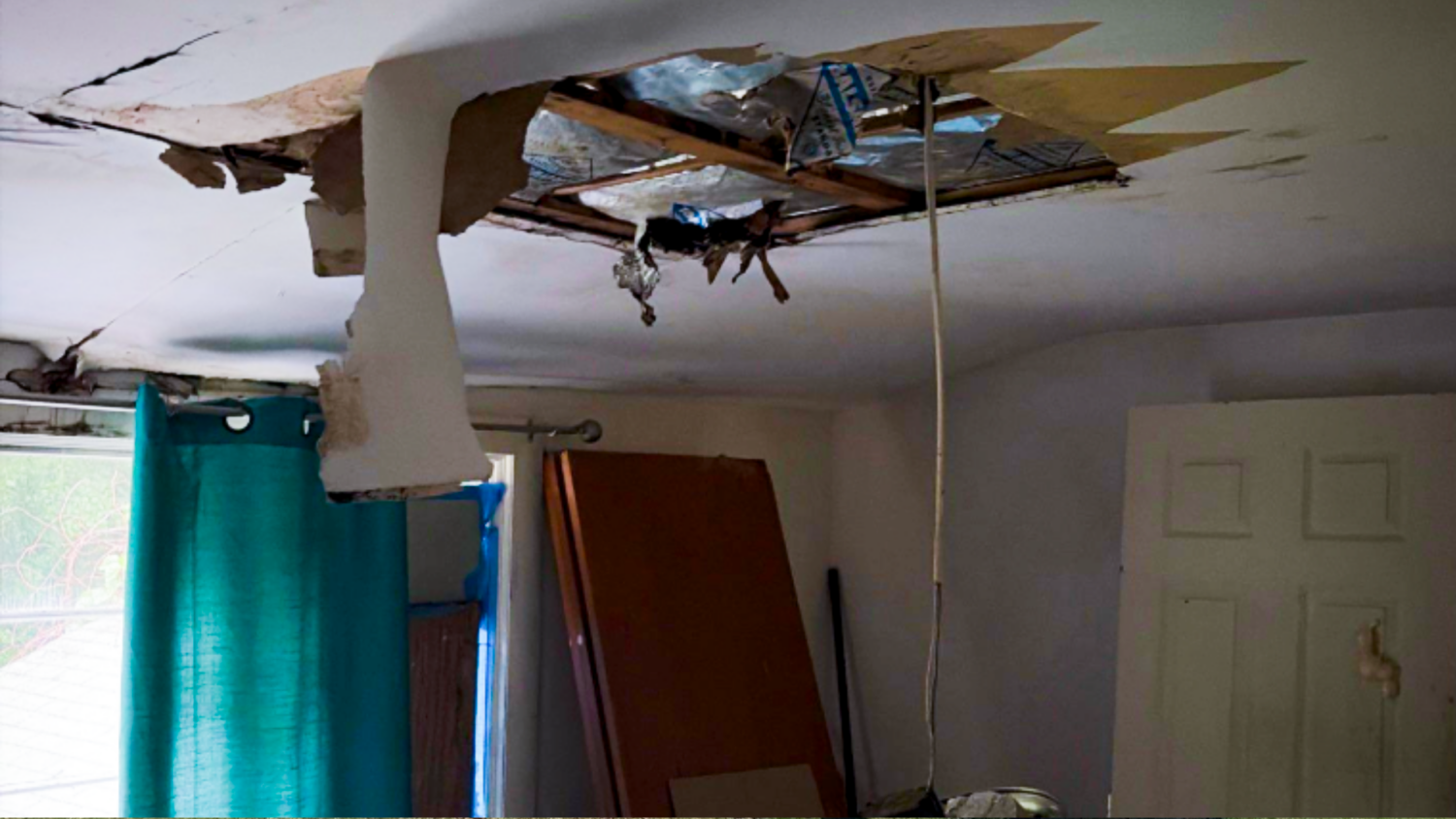 Interior ceiling water damage in a Beverly, MA home, highlighting the need for a trusted exterior remodeling contractor.