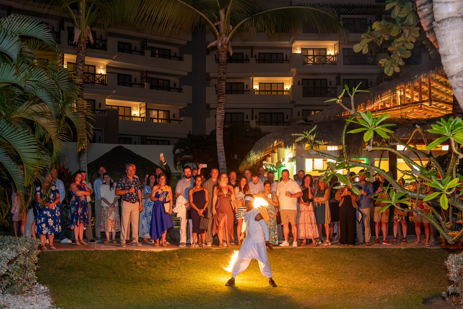 Guests gather outdoors to watch a fire performance during a company celebration recognizing a year of industry achievement. That same resilience is what makes storm-resistant gray vinyl siding a popular choice for Cape Cod homes facing coastal winds.