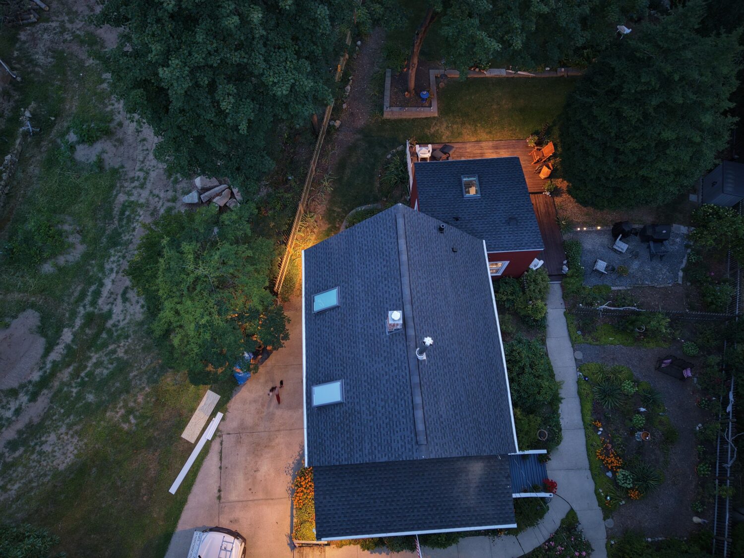 Aerial view of a storm-resistant roof replacement with skylights in Medford, Greater Boston by Coastal Windows & Exteriors.
