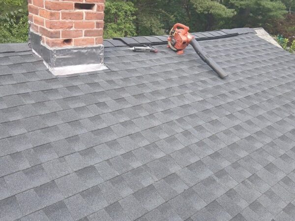 Roof replacement addressing shingle damage in Phillipston, MA by Coastal Windows & Exteriors.