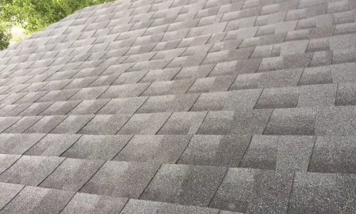 Dark gray asphalt roofing installation
