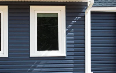 blue vinyl siding and window installation by Coastal Windows & Exteriors